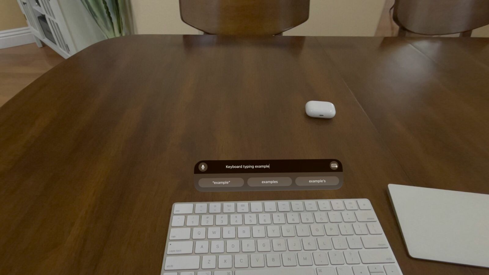 A physical keyboard with a virtual text window above it.