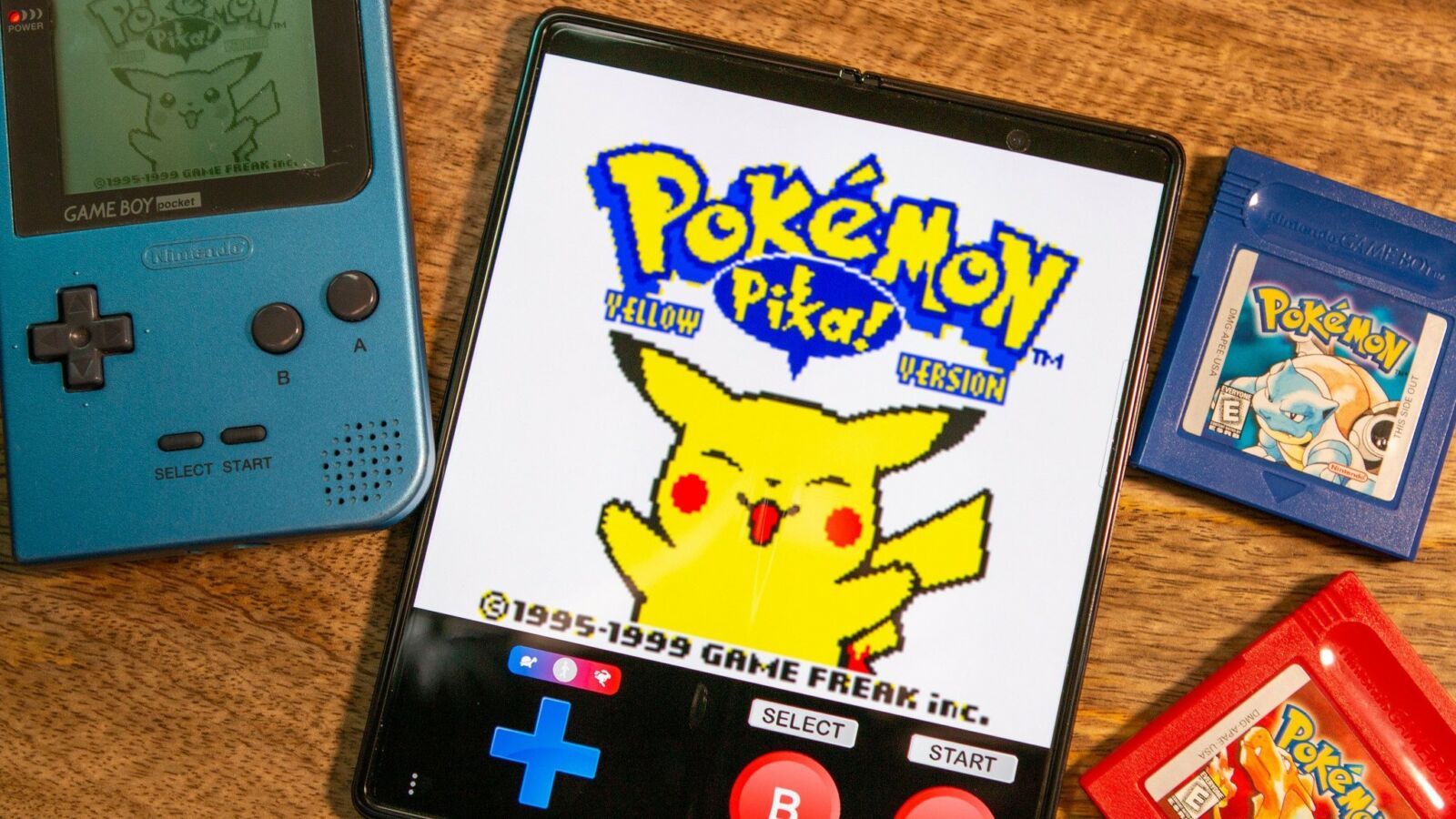 Pokemon Yellow on Galaxy Fold with Game Boy Pocket and Pokemon cartridges