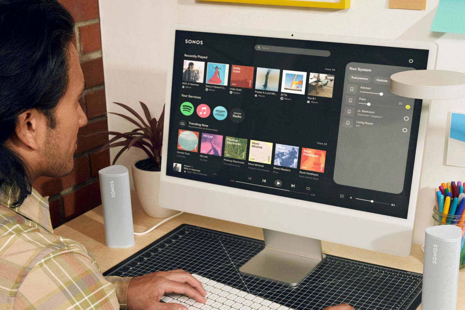 Someone using the new Sonos web app on a desktop computer.