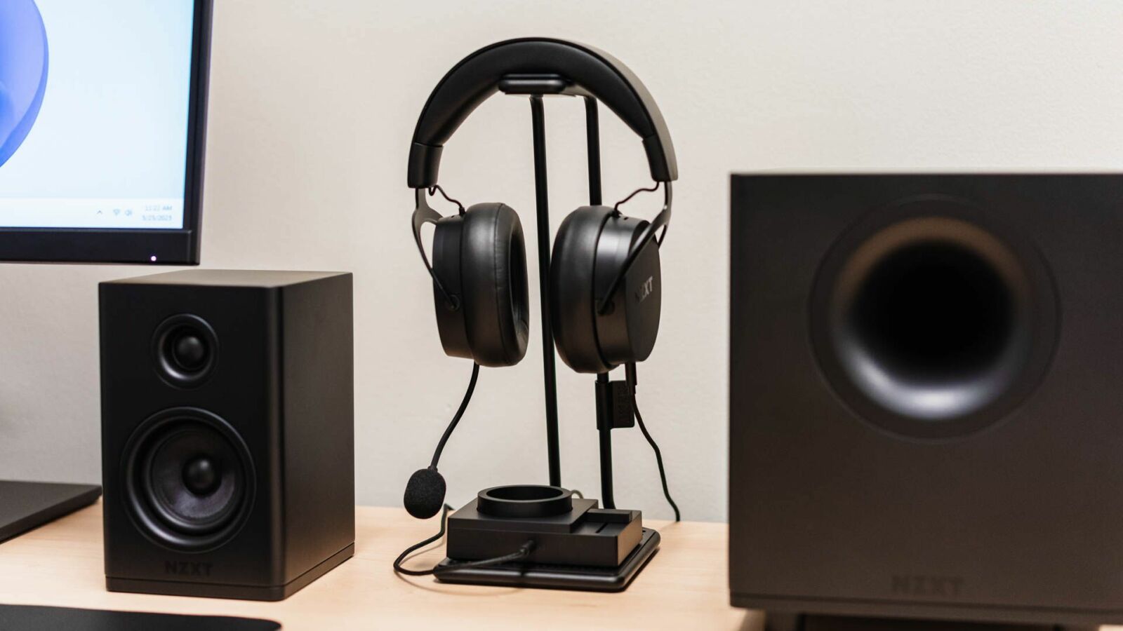 NZXT Switch Mix set up at a desk with the NZXT Relay Headset and speakers