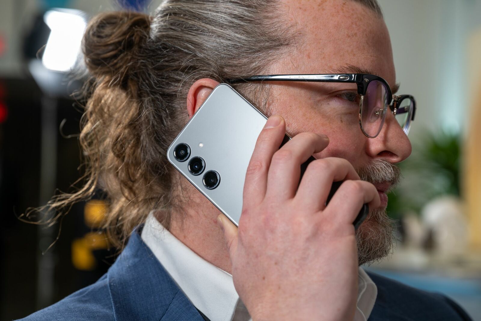 Person taking a phone call with the Samsung Galaxy S24+.