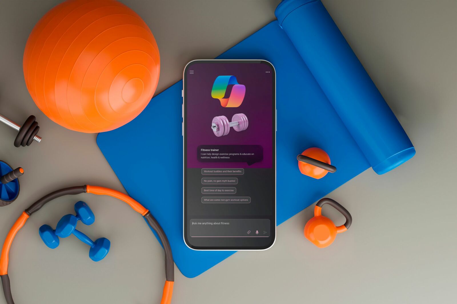 A smartphone surrounded by gym equipment with the Microsoft Copilot trainer open.