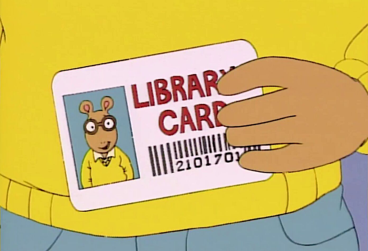 Arthur holding a library card.