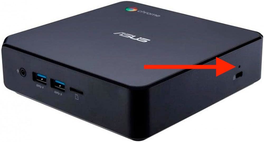 A Chromebox with an arrow pointing to the recovery button.