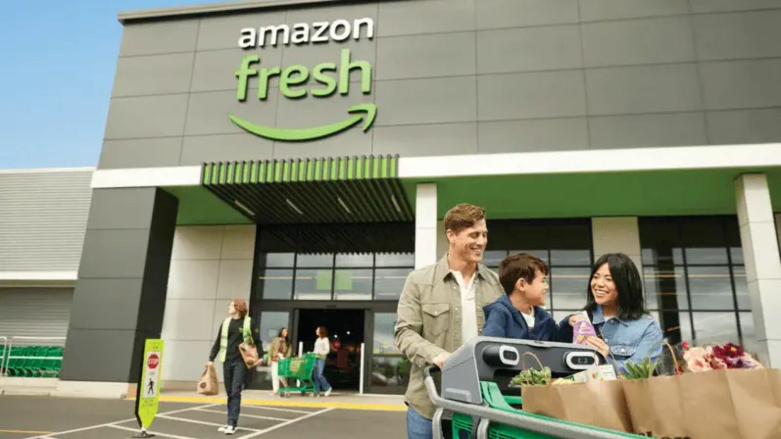 Family walking out of an Amazon fresh retail store.