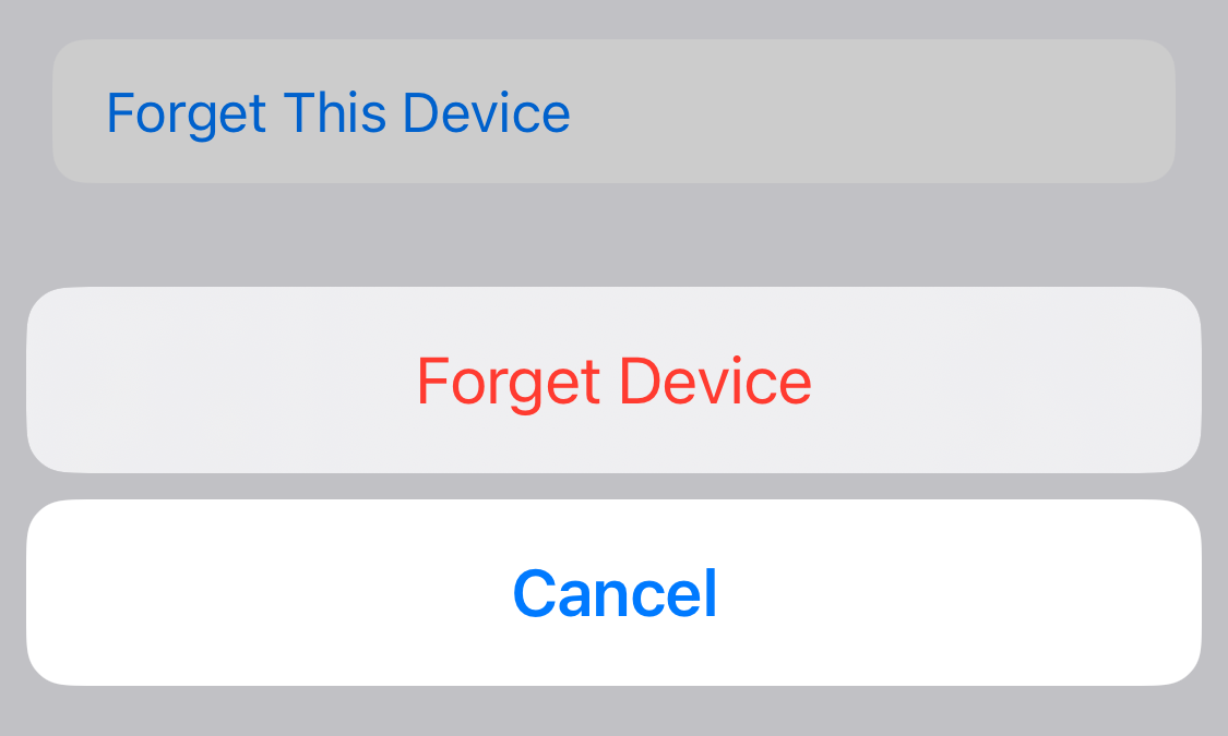 'Forget This Device' option in iPhone Bluetooth settings.