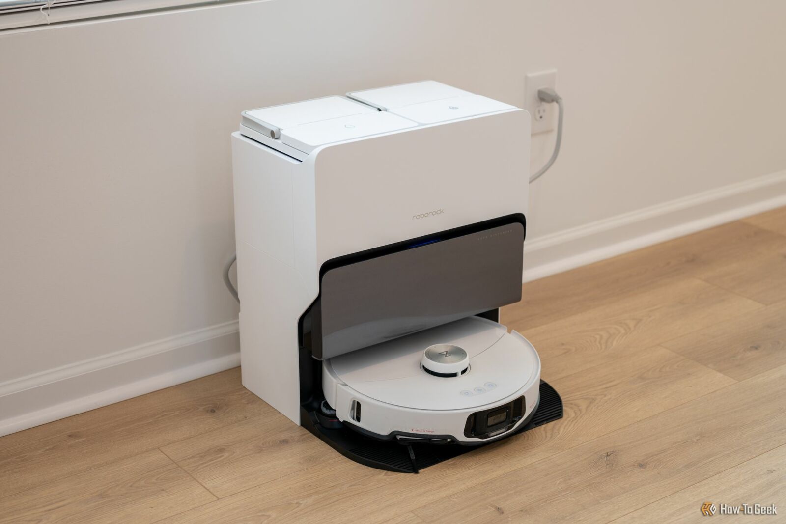 Roborock S8 MaxV Ultra sitting in its self emptying docking station