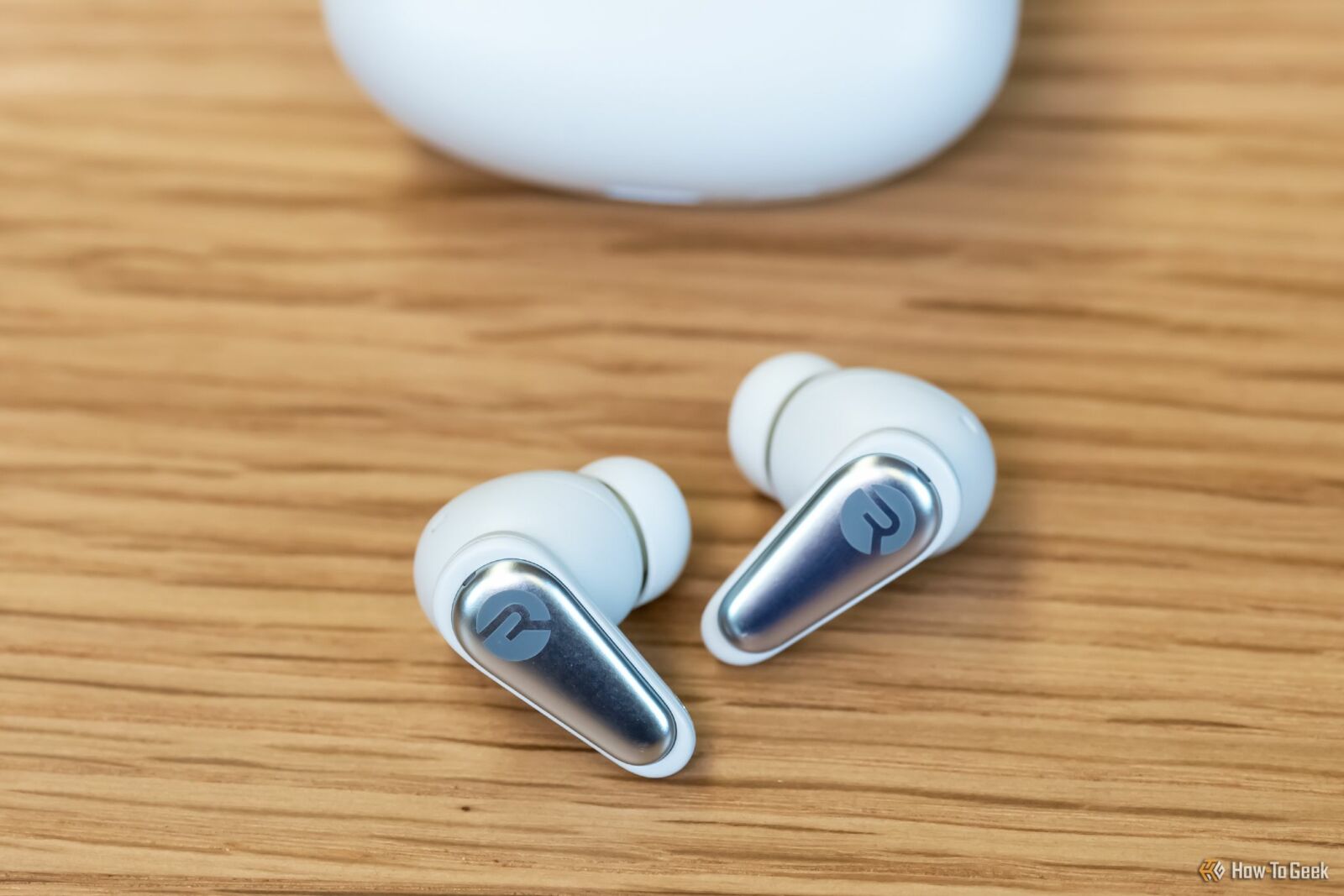 The Raycon Everyday Earbuds Pro in front of their case