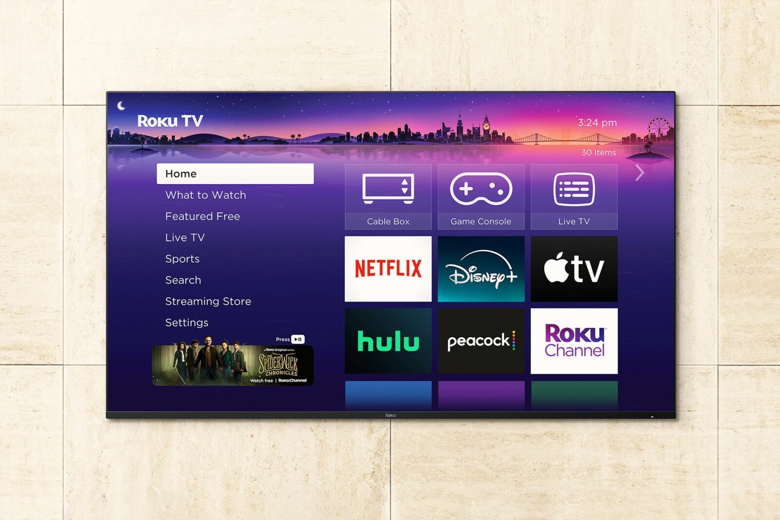 A Roku TV mounted to a wall.