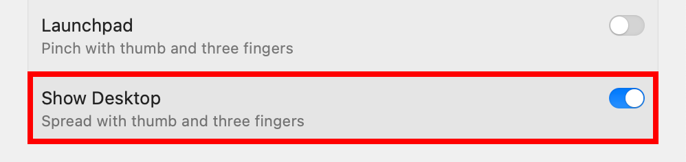 macOS System Settings with the Show Desktop trackpad gesture enabled.