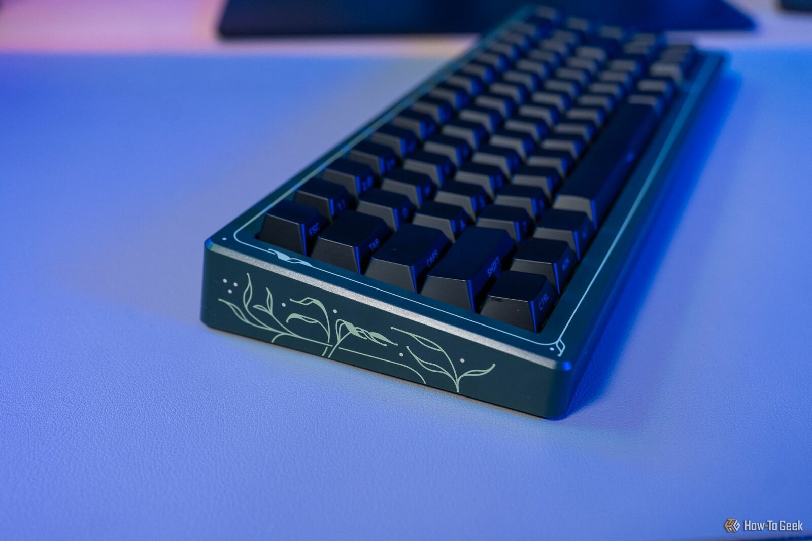 Side view of the drop CSTM65 keyboard with a custom cover attached